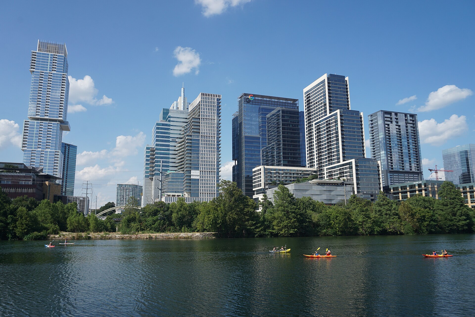 Downtown Austin skyline over Lady Bird Lake with kayakers